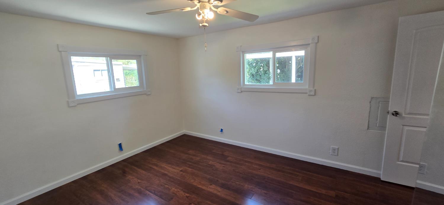189 Full Circle Davis, CA 95618 - Photo 18 of 29 a view of an empty room with wooden floor and a window