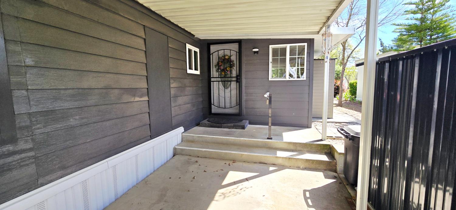 189 Full Circle Davis, CA 95618 - Photo 19 of 29 a view of balcony with two chairs and a window