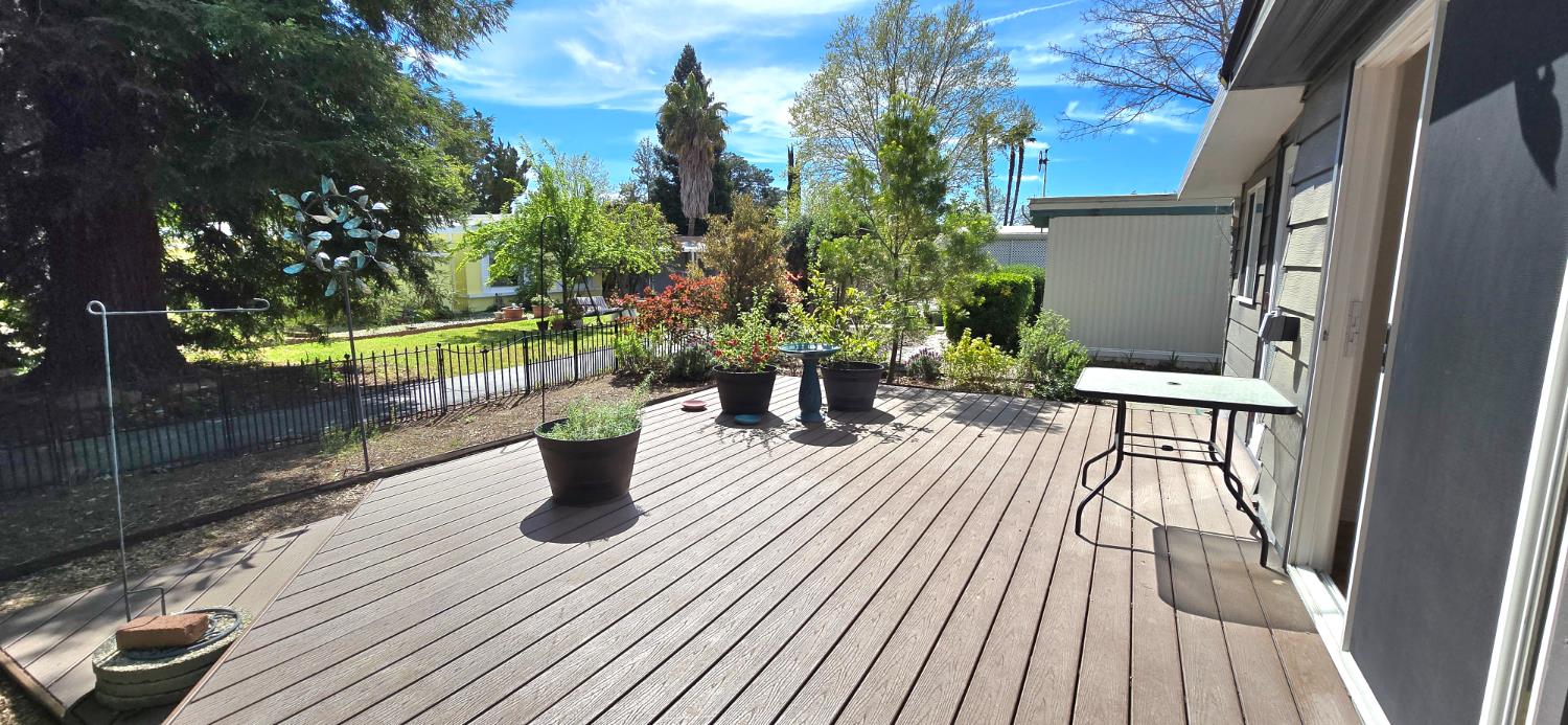 189 Full Circle Davis, CA 95618 - Photo 20 of 29 a view of a roof deck with dining table and chairs with wooden floor