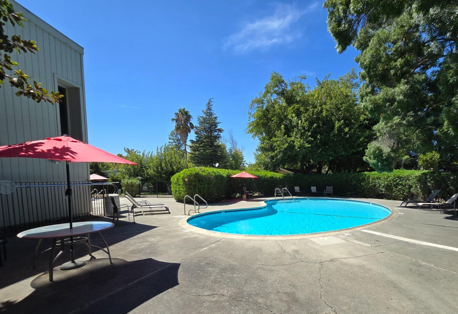 189 Full Circle Davis, CA 95618 - Photo 27 of 29 a view of a swimming pool with a yard