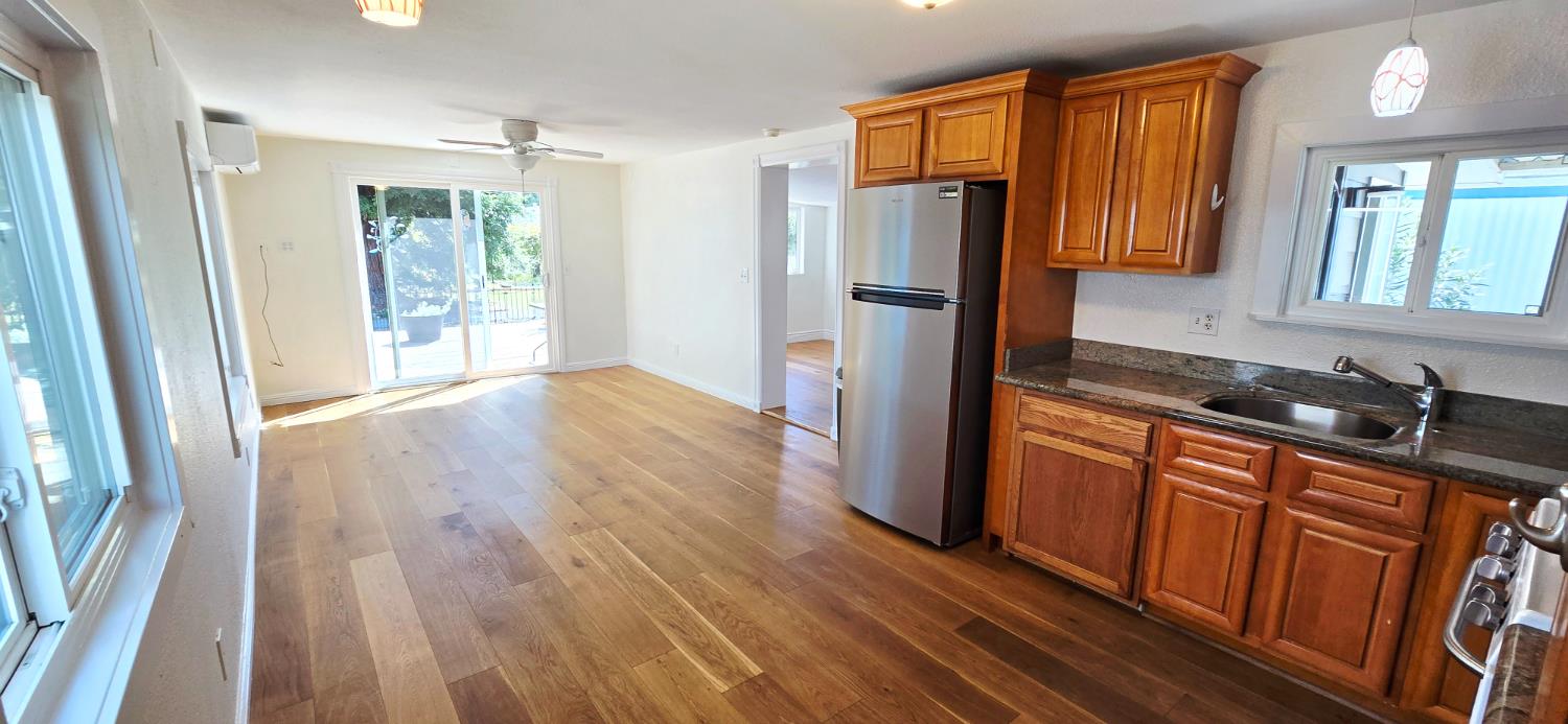 189 Full Circle Davis, CA 95618 - Photo 5 of 29 a kitchen with stainless steel appliances granite countertop a refrigerator and a sink