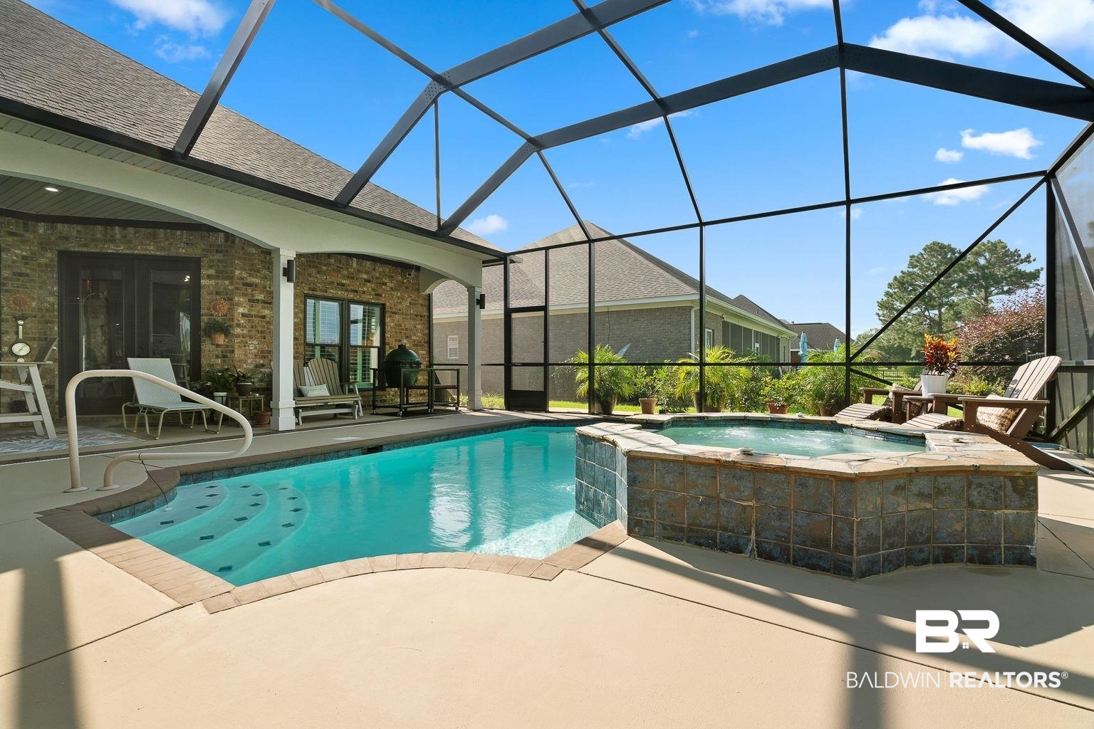 23357 Carnoustie Drive Foley, AL 36535 - Photo 29 of 99 View of pool featuring a patio area, glass enclosure, and a pool with connected hot tub