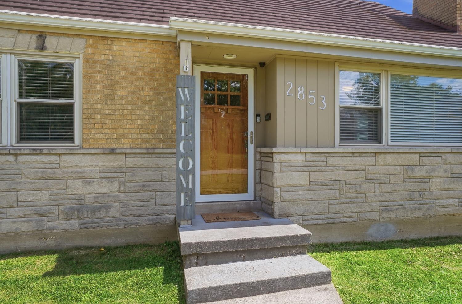 2853 Werk Road Cincinnati, OH 45211 - Photo 8 of 62 ·Custom-built craftsman-style front door with dentil shelf and triple pane windows