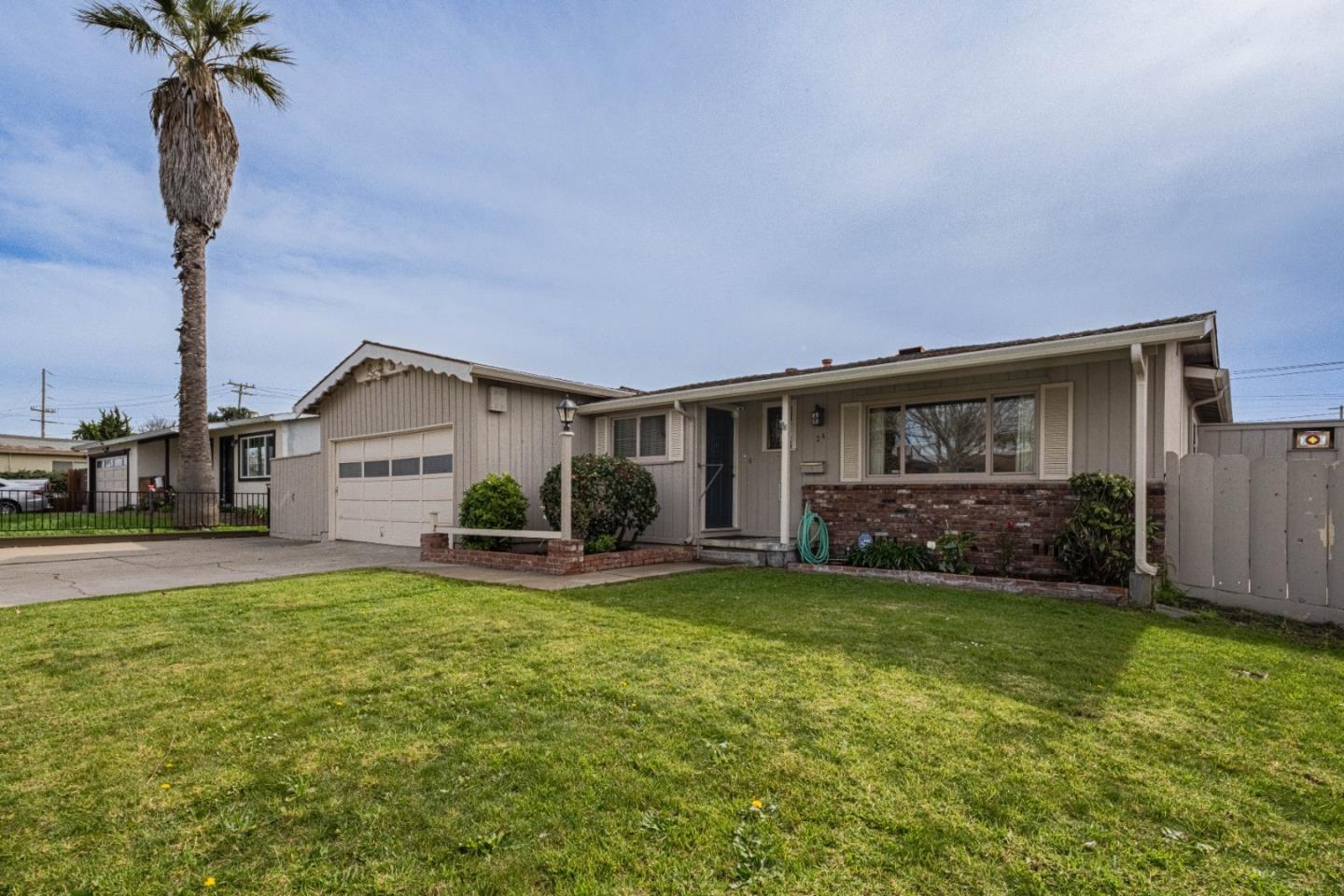 24 St Francis Way Salinas, CA 93906 - Photo 3 of 25 a view of a house with a yard and garage