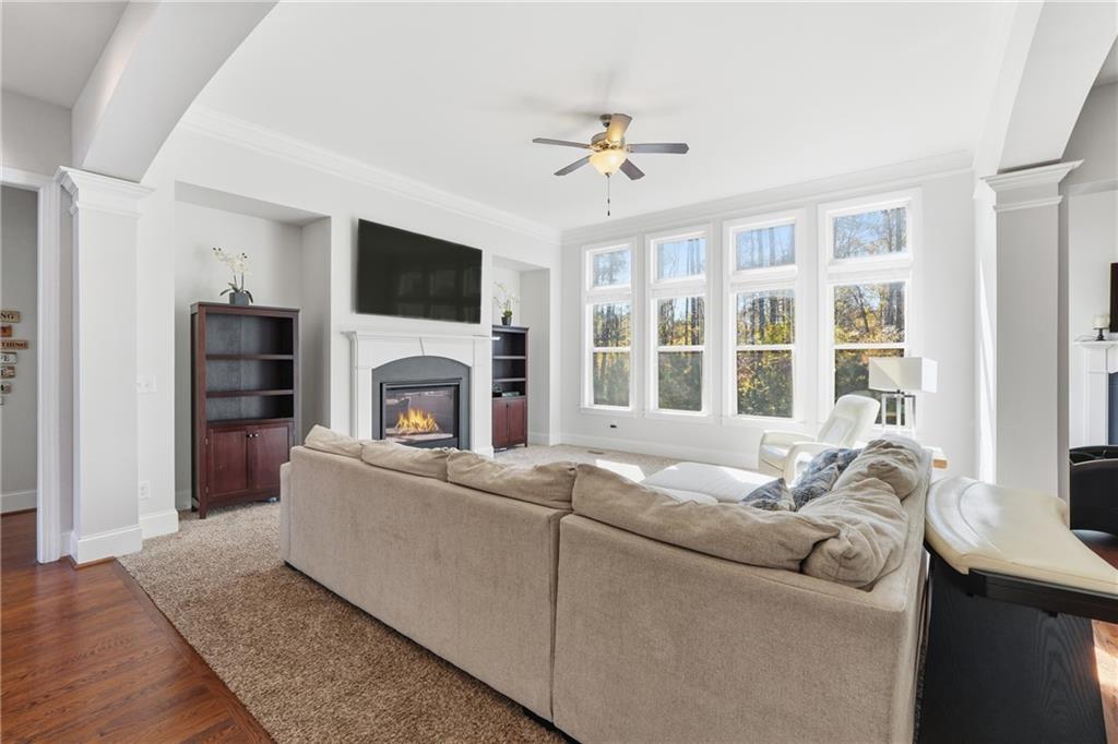4409 Talisker Lane Acworth, GA 30101 - Photo 11 of 61 a living room with furniture a flat screen tv and a fireplace