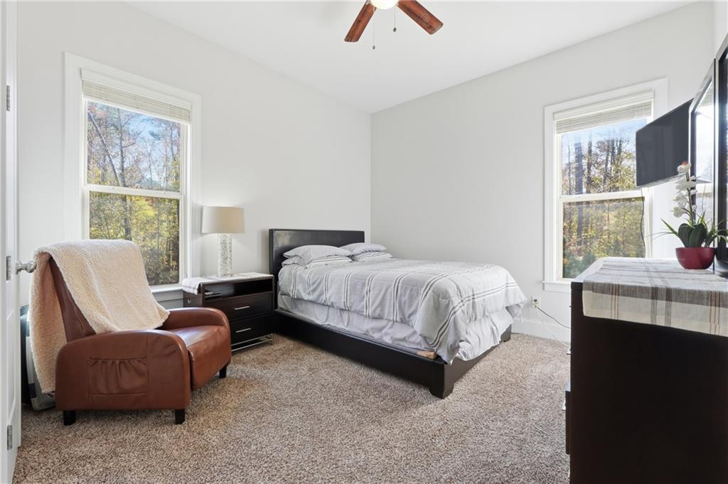 4409 Talisker Lane Acworth, GA 30101 - Photo 24 of 61 a bedroom with a bed and a couch