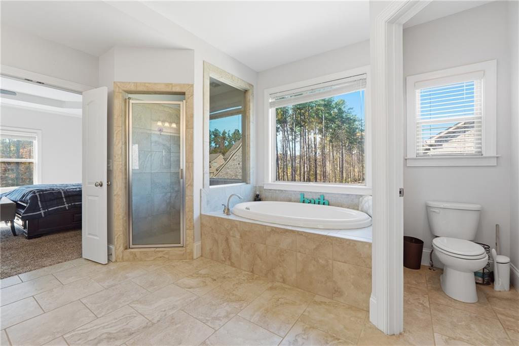 4409 Talisker Lane Acworth, GA 30101 - Photo 32 of 61 a spacious bathroom with a bathtub toilet and sink