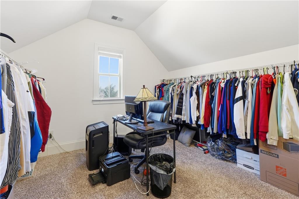 4409 Talisker Lane Acworth, GA 30101 - Photo 34 of 61 a view of walk in closet with clothes