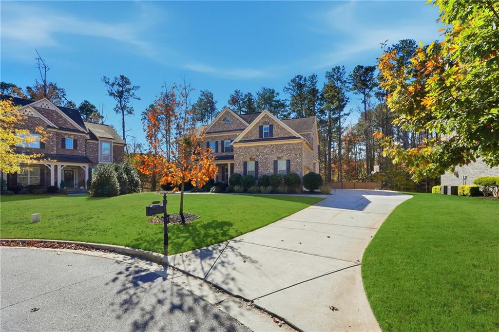 4409 Talisker Lane Acworth, GA 30101 - Photo 54 of 61 a front view of a house with a yard and garage