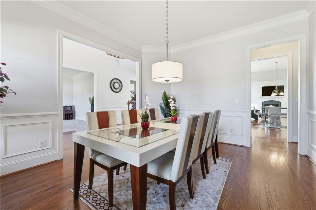 4409 Talisker Lane Acworth, GA 30101 - Photo 9 of 61 a view of a dining room with furniture and wooden floor