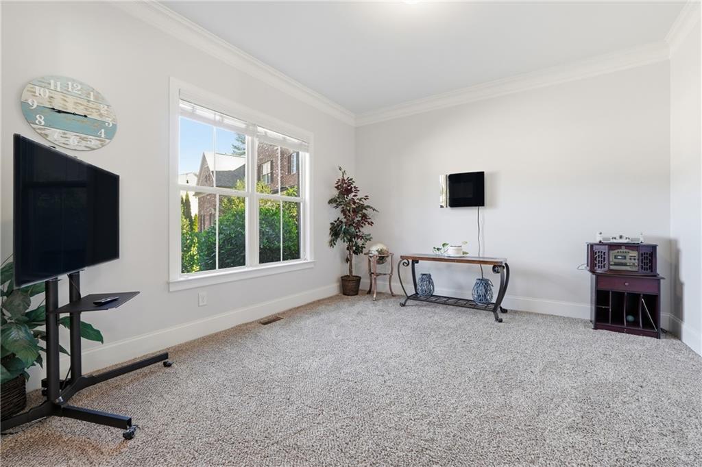 4409 Talisker Lane Acworth, GA 30101 - Photo 10 of 61 a living room with furniture and a flat screen tv