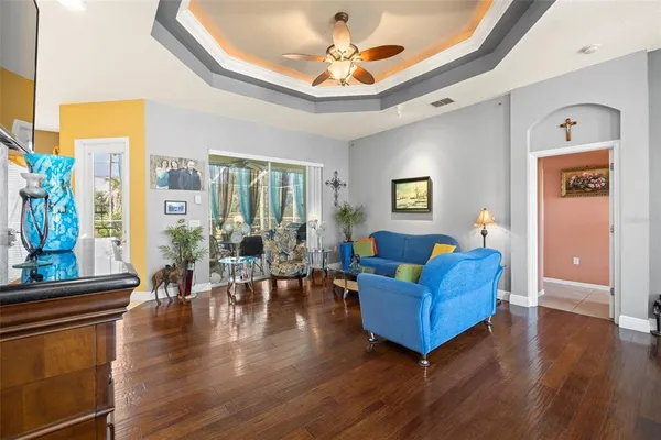 a living room with furniture and a flat screen tv