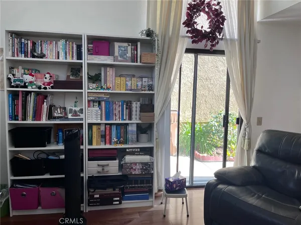 a view of a backyard with plants and a fountain