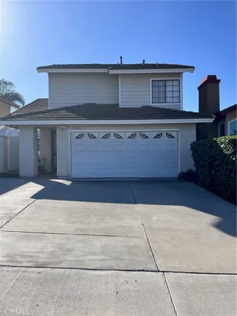 a front view of a house with garage
