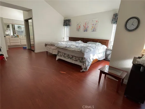 a bedroom with a bed and gym equipment