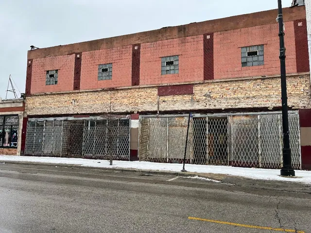 a front view of a house with a fence