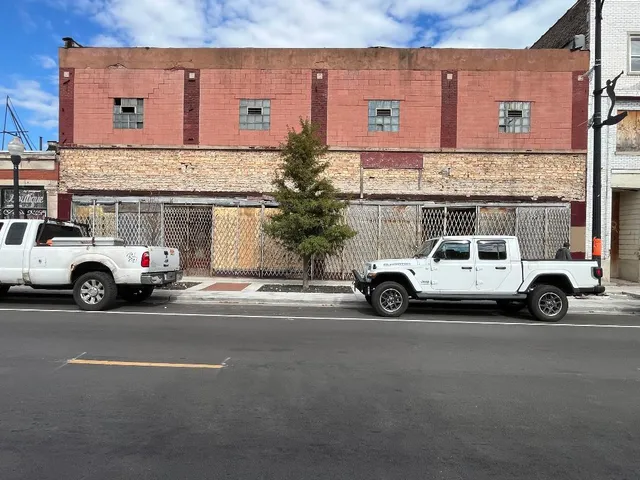 a view of a cars parked in front of a building