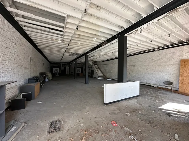 a view of an empty room with stairs