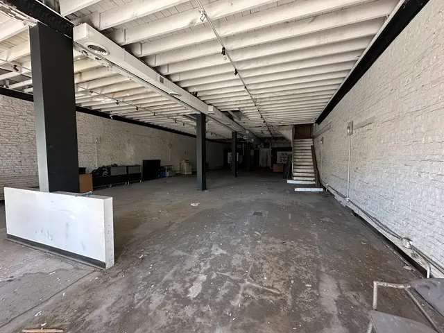 a view of an empty room with stairs