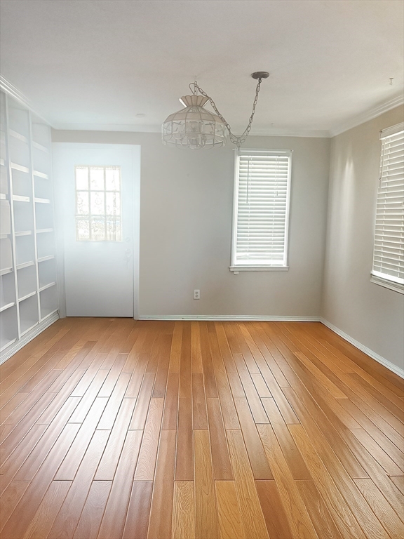 292 Megan Road Barnstable, MA 02601 - Photo 11 of 12 an empty room with wooden floor and windows