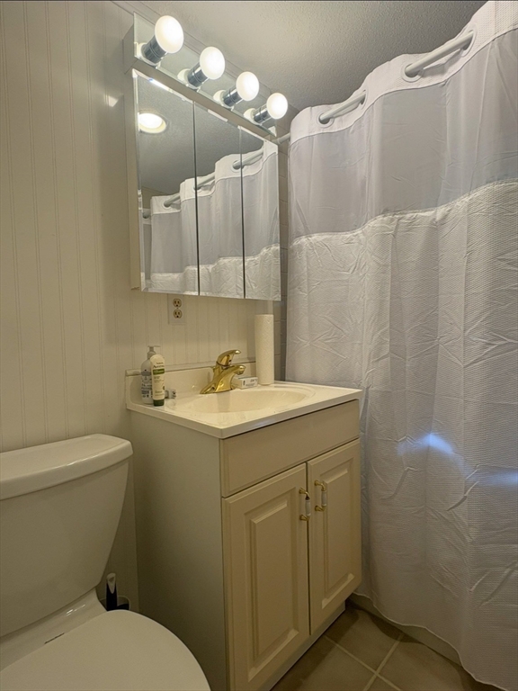 292 Megan Road Barnstable, MA 02601 - Photo 7 of 12 a bathroom with a sink a toilet and mirror