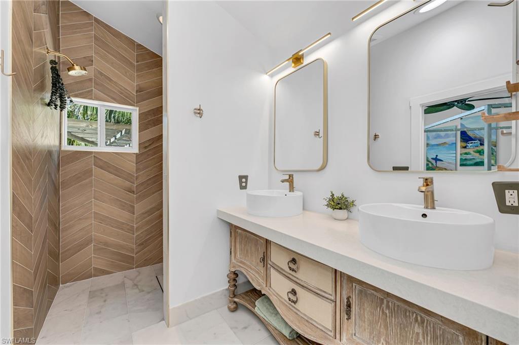 1155 12th Street North Naples, FL 34102 - Photo 11 of 18 Full bath with a walk in shower and double vanity