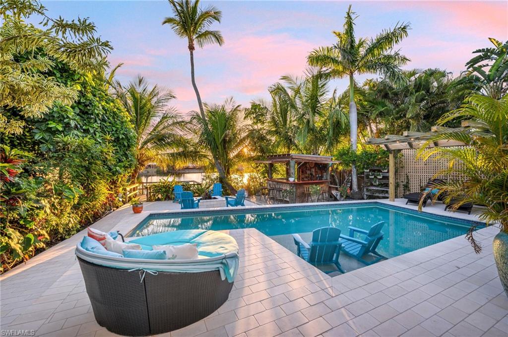 1155 12th Street North Naples, FL 34102 - Photo 4 of 18 Outdoor pool featuring a patio area and a bar