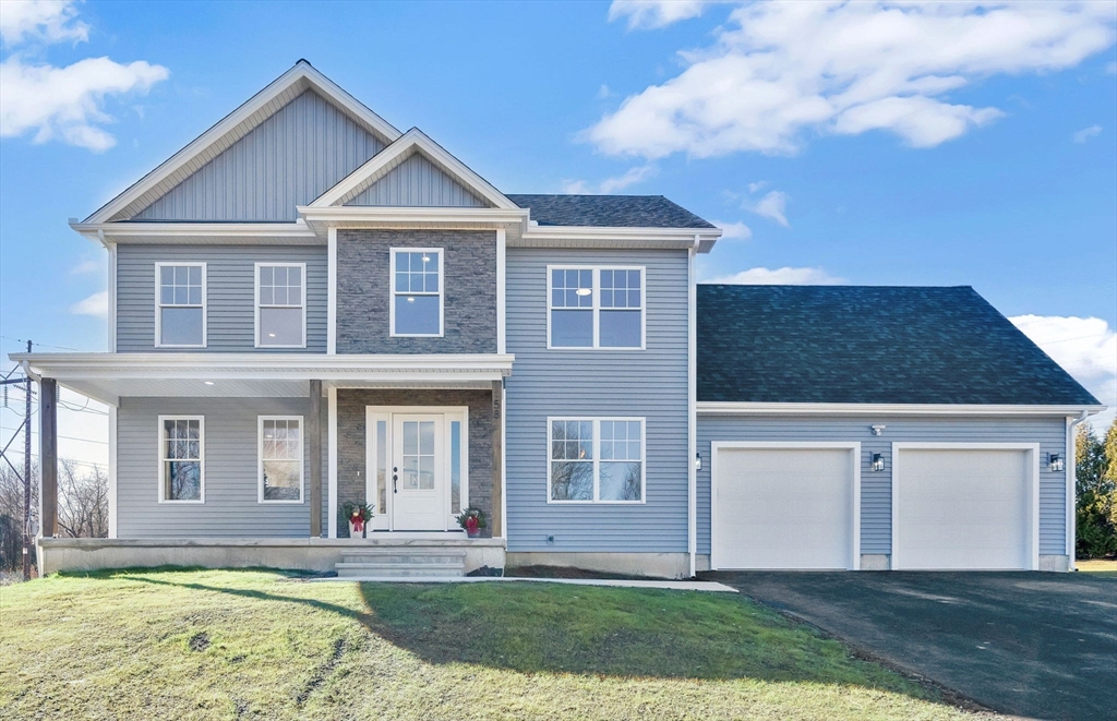 58 Mariana Lane Ludlow, MA 01056 - Photo 1 of 40 a front view of a house with garden