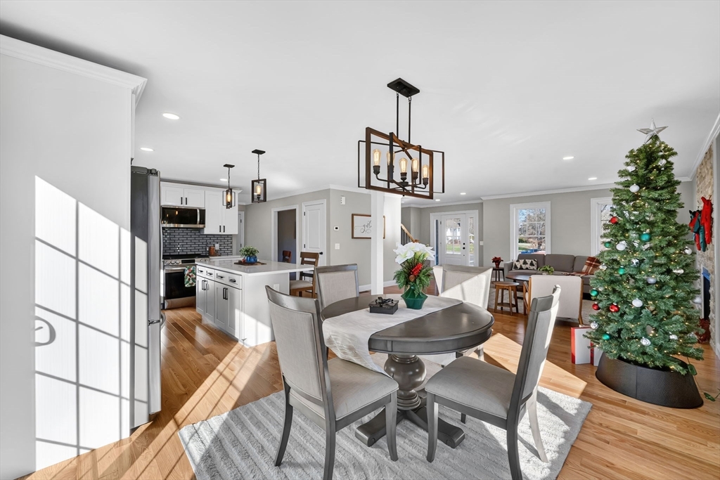 58 Mariana Lane Ludlow, MA 01056 - Photo 12 of 40 a view of a dining room with furniture and wooden floor