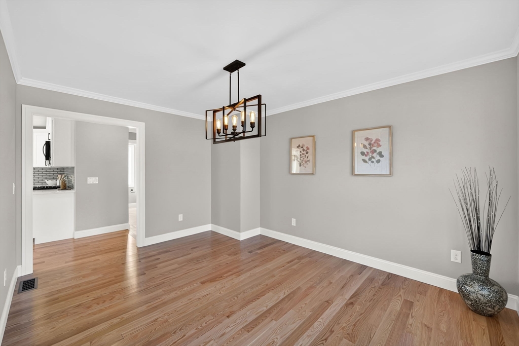 58 Mariana Lane Ludlow, MA 01056 - Photo 14 of 40 a view of a room with wooden floor and a chandelier