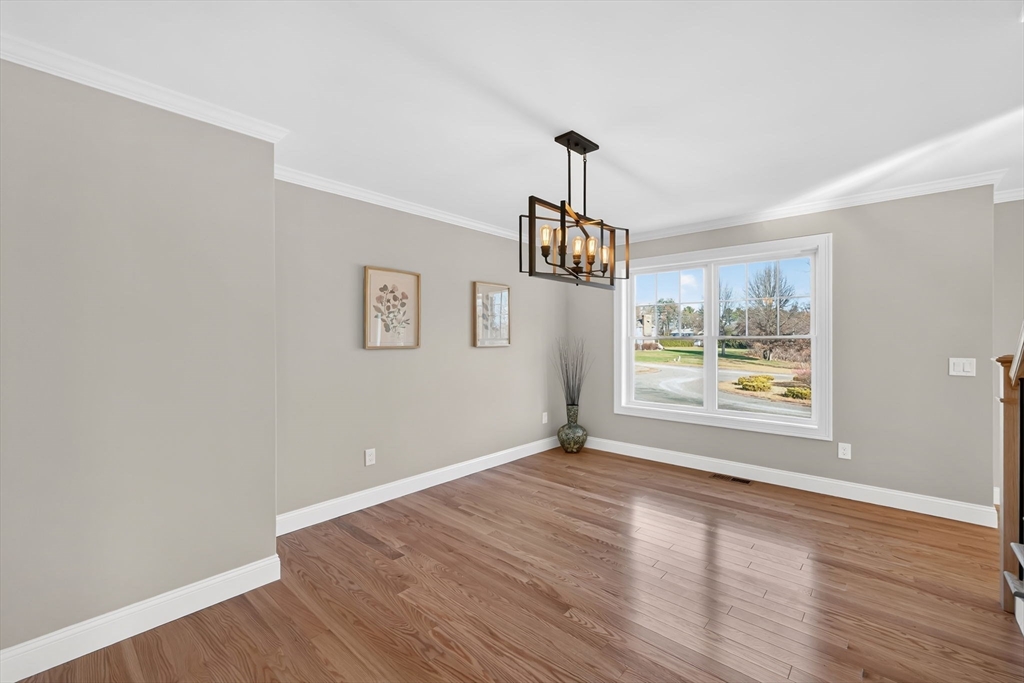 58 Mariana Lane Ludlow, MA 01056 - Photo 17 of 40 a view of an empty room with window and wooden floor