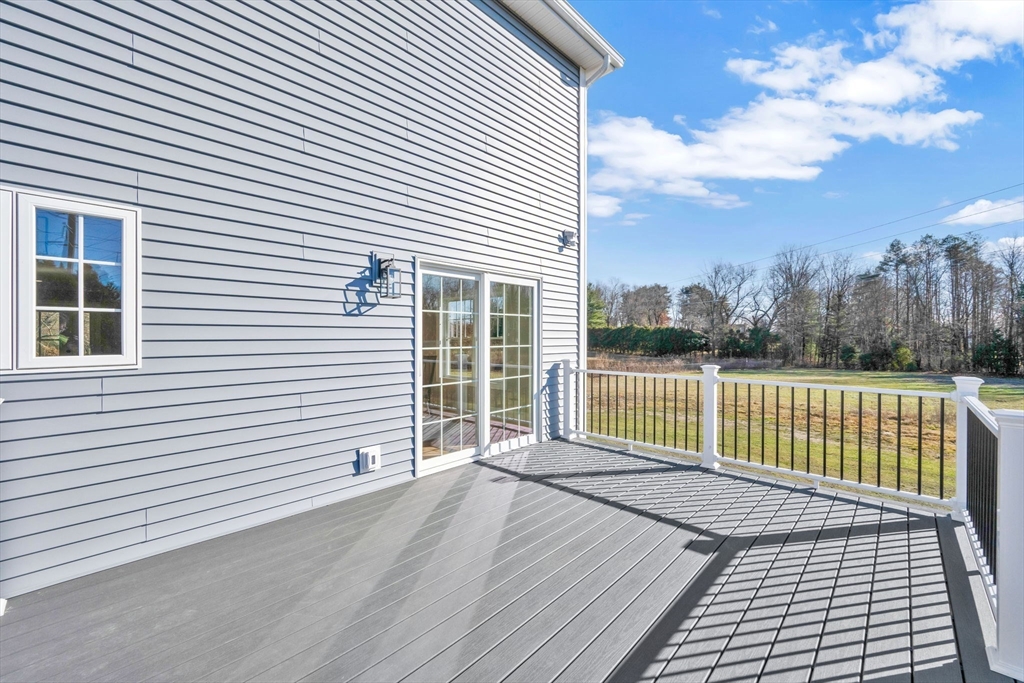 58 Mariana Lane Ludlow, MA 01056 - Photo 40 of 40 a view of a balcony with a floor to ceiling window and wooden floor