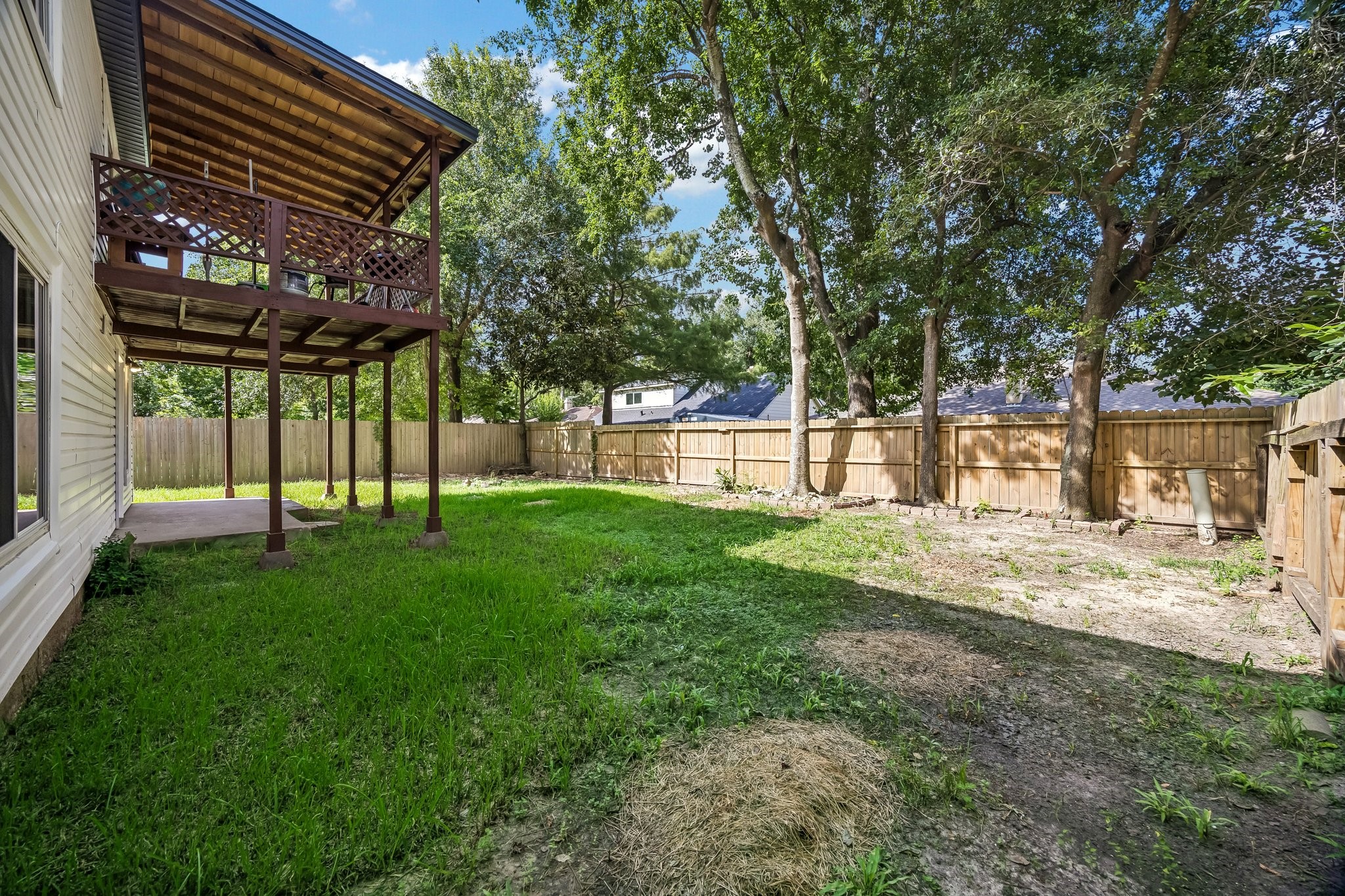 23319 Whispering Willow Drive Spring, TX 77373 - Photo 23 of 31 Backyard oasis with Dual level outdoor covered patio