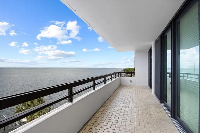 a view of balcony with furniture