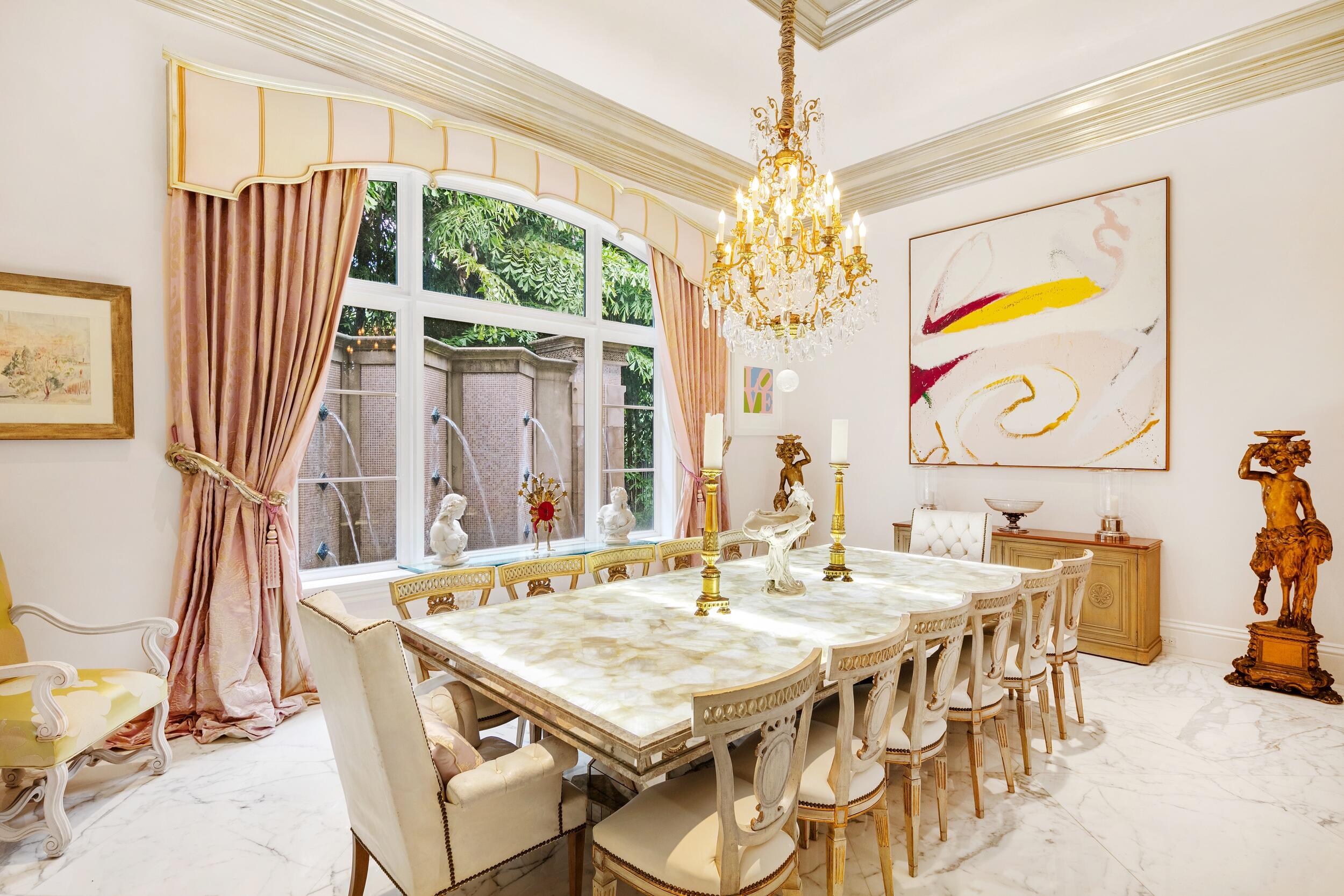 372 Regatta Drive Jupiter, FL 33477 - Photo 37 of 93 a view of a dining room with furniture a chandelier and large windows