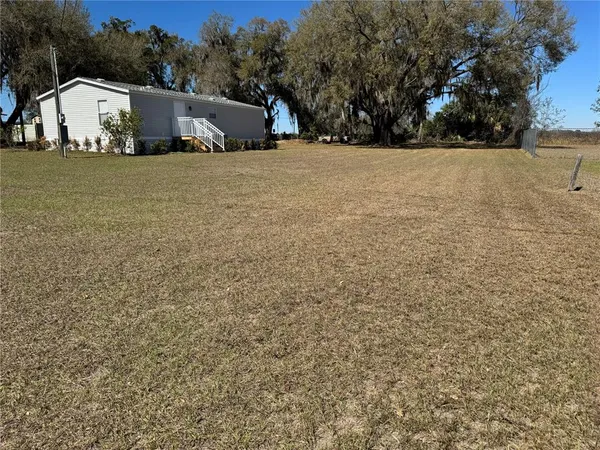 a house with trees in the background