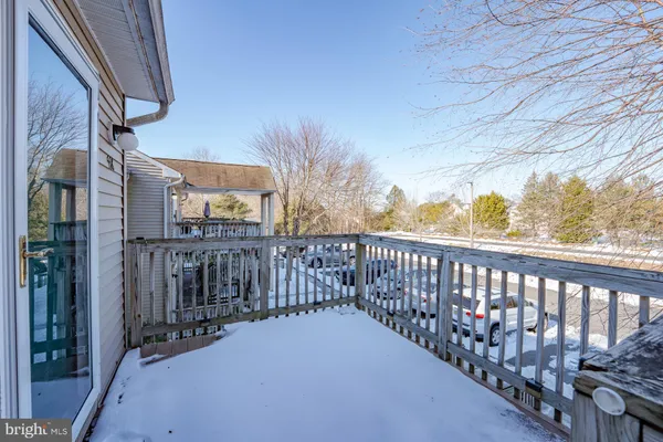 a view of a balcony with wooden fence