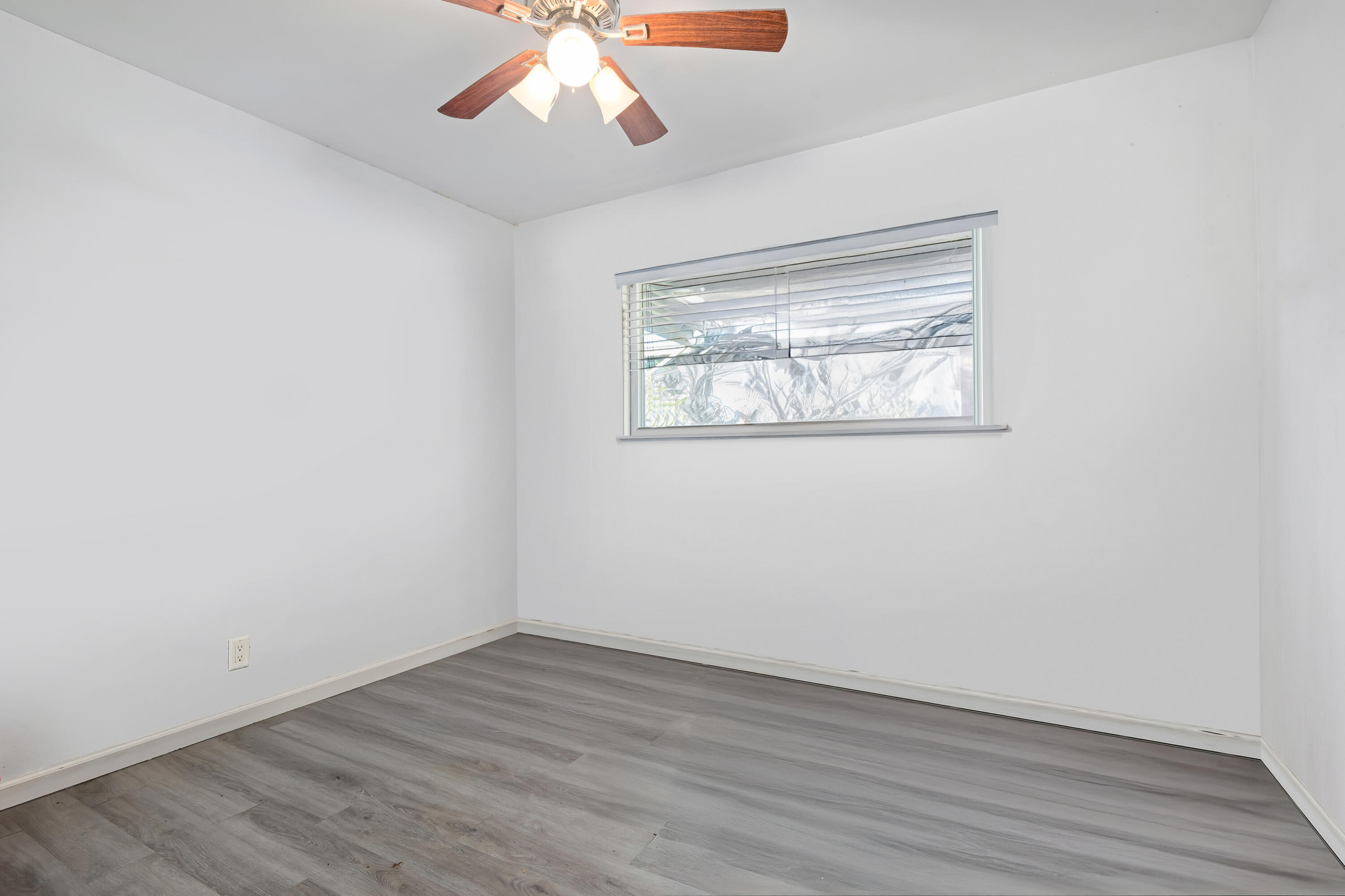 901 West Olive Street Oxnard, CA 93033 - Photo 14 of 20 an empty room with wooden floor and windows