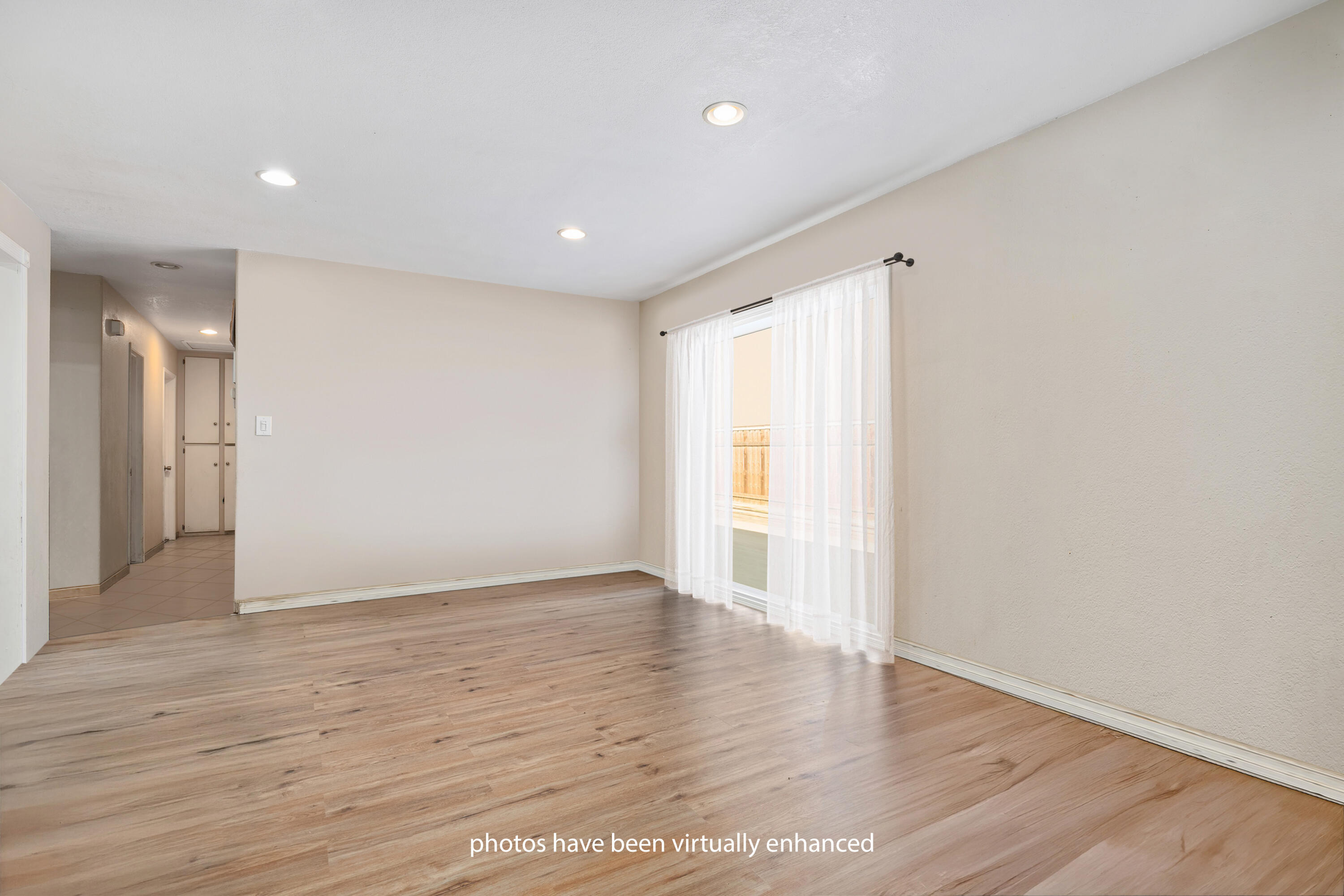 901 West Olive Street Oxnard, CA 93033 - Photo 5 of 20 a view of an empty room with wooden floor and a window