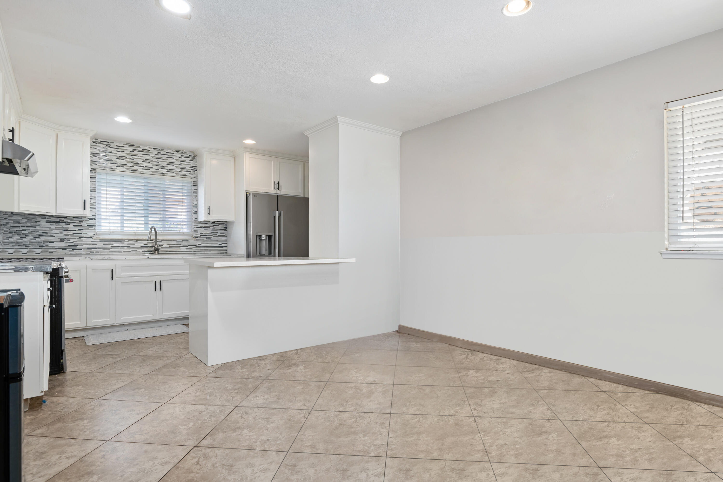 901 West Olive Street Oxnard, CA 93033 - Photo 6 of 20 a kitchen with a sink cabinets and window