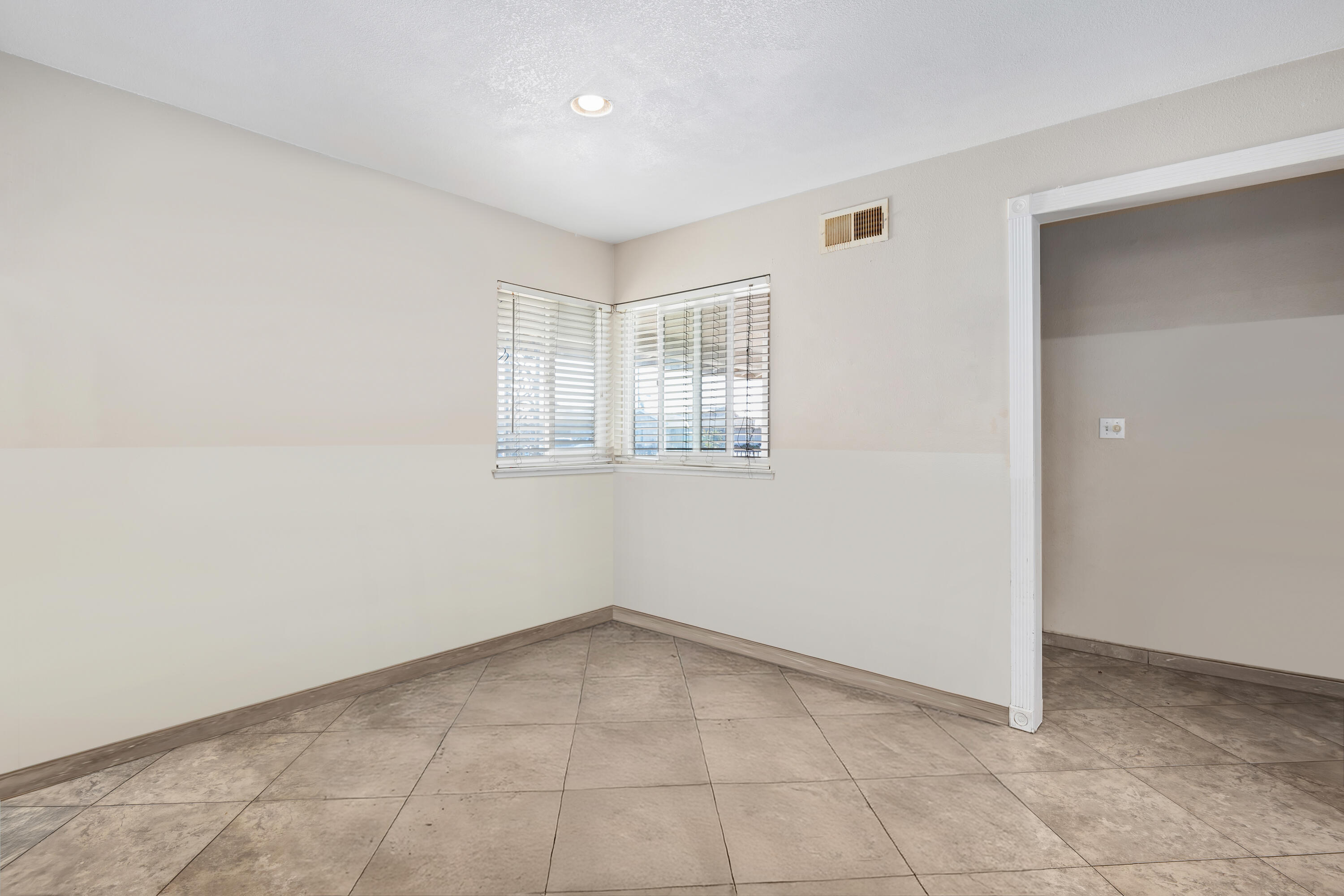 901 West Olive Street Oxnard, CA 93033 - Photo 7 of 20 an empty room with a empty space and windows