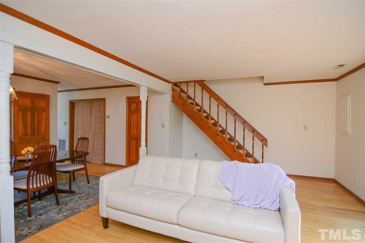 5433 Pine Top Circle Raleigh, NC 27612 - Photo 13 of 23 a living room with furniture or stairs and a couch