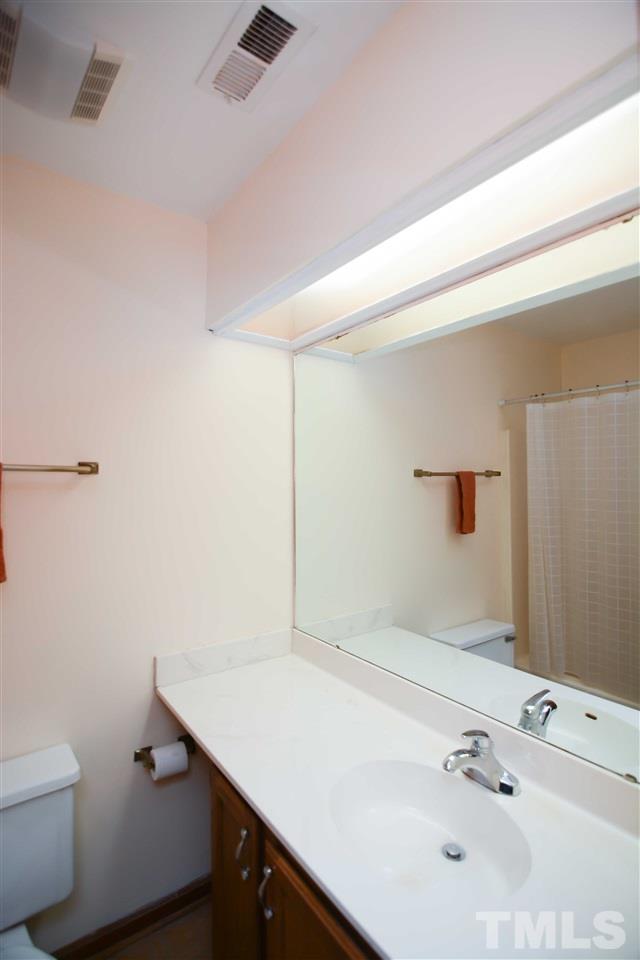 5433 Pine Top Circle Raleigh, NC 27612 - Photo 17 of 23 a bathroom with a sink and a toilet