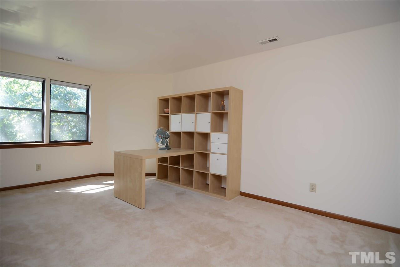5433 Pine Top Circle Raleigh, NC 27612 - Photo 18 of 23 an empty room with a window