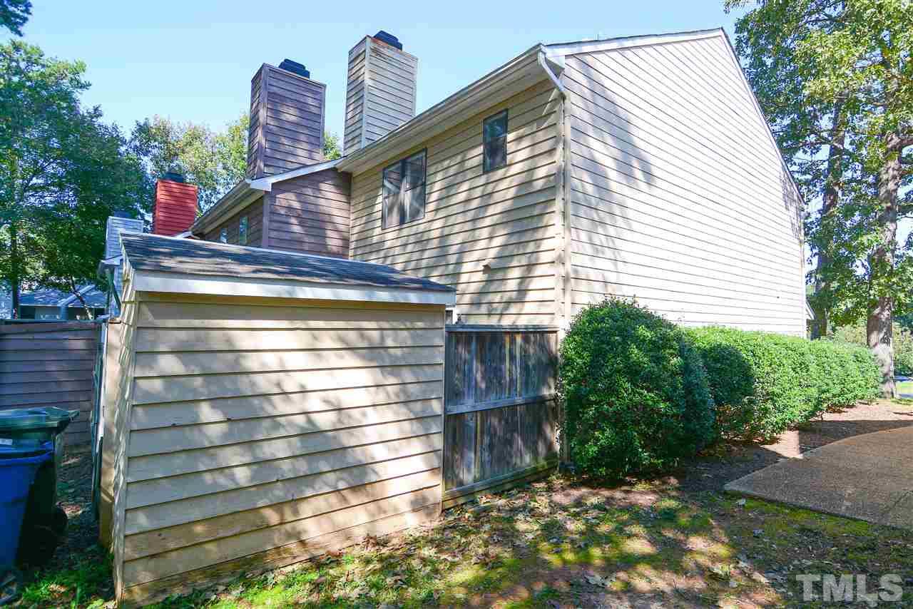 5433 Pine Top Circle Raleigh, NC 27612 - Photo 3 of 23 a view of a house with a yard and potted plants