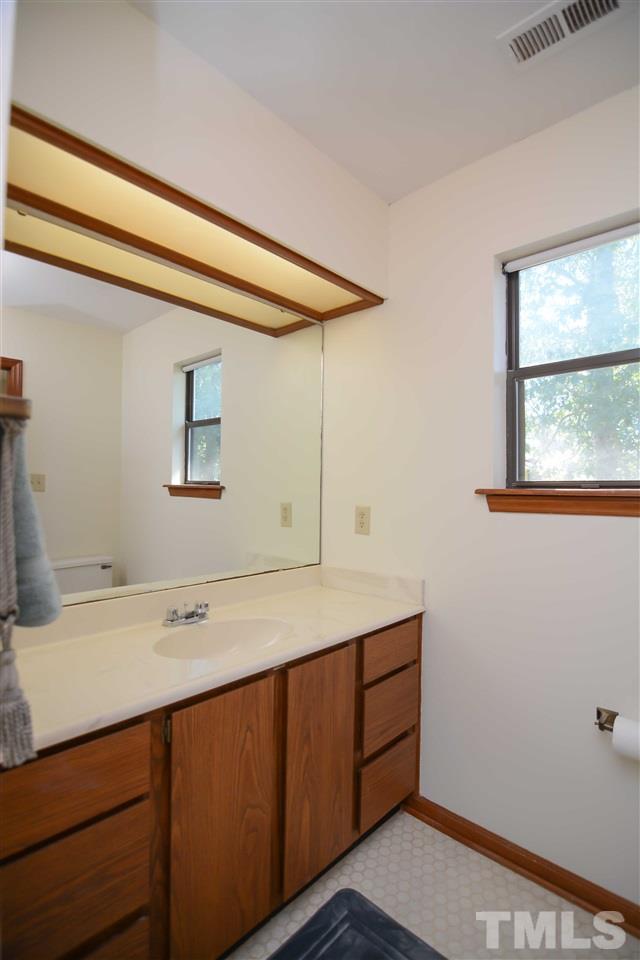 5433 Pine Top Circle Raleigh, NC 27612 - Photo 21 of 23 a utility room with a sink dryer and a window