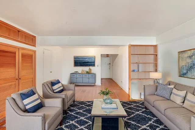 a view of an empty room and wooden floor