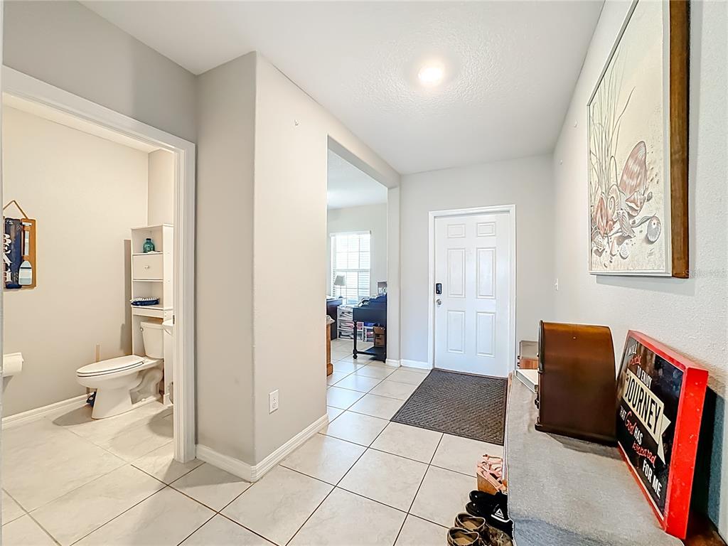 1511 Tiger Tooth Place Ruskin, FL 33570 - Photo 13 of 59 a spacious bathroom with a glass door shower and a toilet