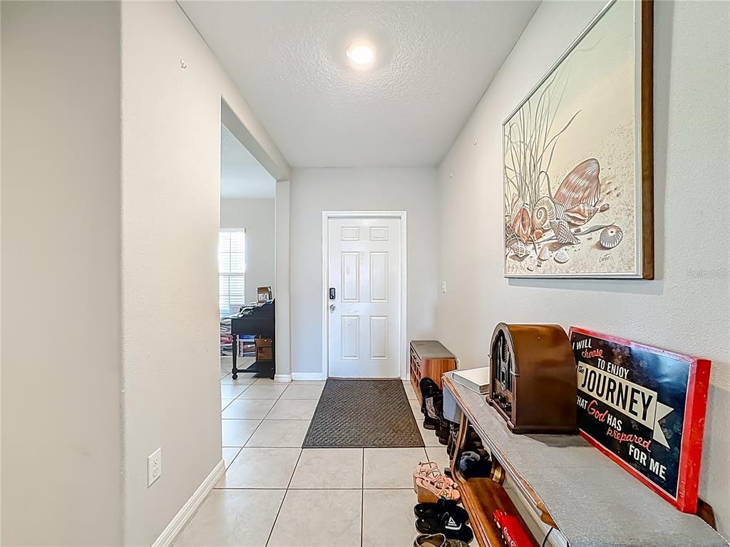 1511 Tiger Tooth Place Ruskin, FL 33570 - Photo 14 of 59 a room with furniture and a gate