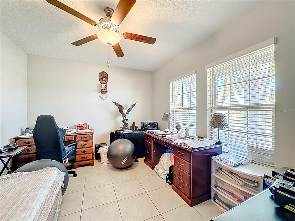 1511 Tiger Tooth Place Ruskin, FL 33570 - Photo 16 of 59 a room with furniture and a wooden floor